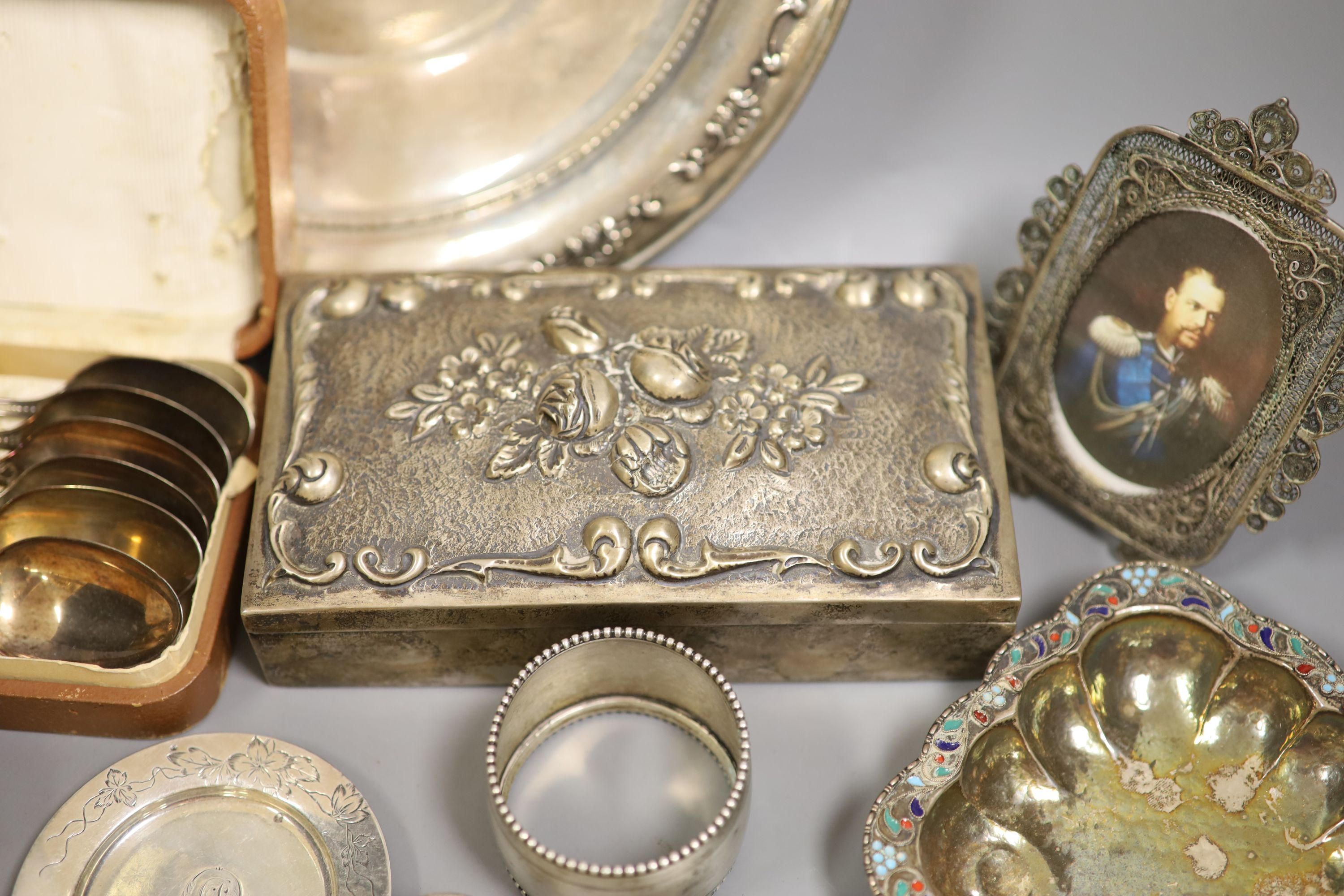 A collection of continental white metal items including 800 cigarette box, sterling plate, Tiffany & Co small dish, flatware etc.